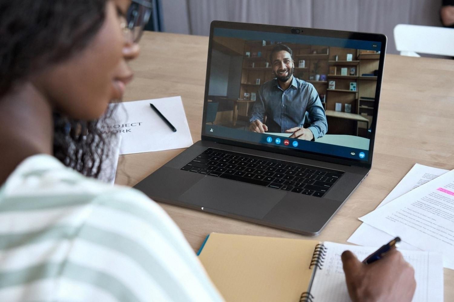 HR consultant conducting a remote competency interview with an employee over a video call